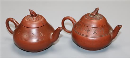 A pair of Chinese Yixing miniature teapots and covers